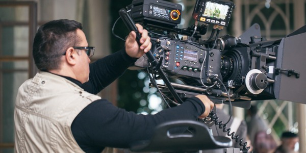 A camera operator operating a camera.