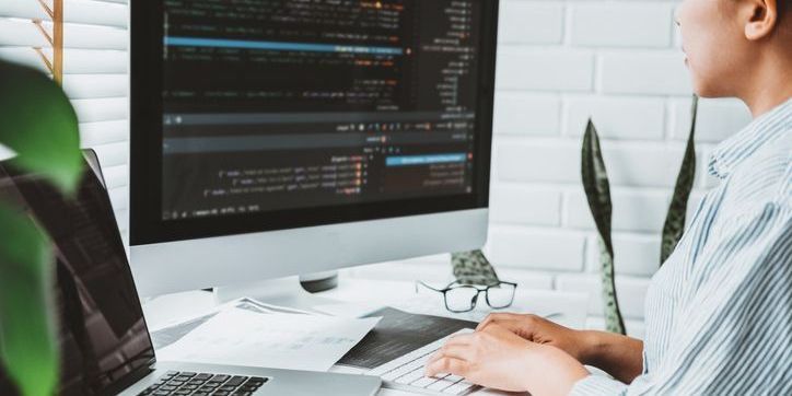 A cloud developer working at her desk.