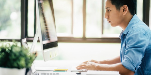 A cybercrime investigator looking at a damaged file system on the computer.