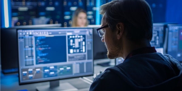 A penetration tester working on his computer.