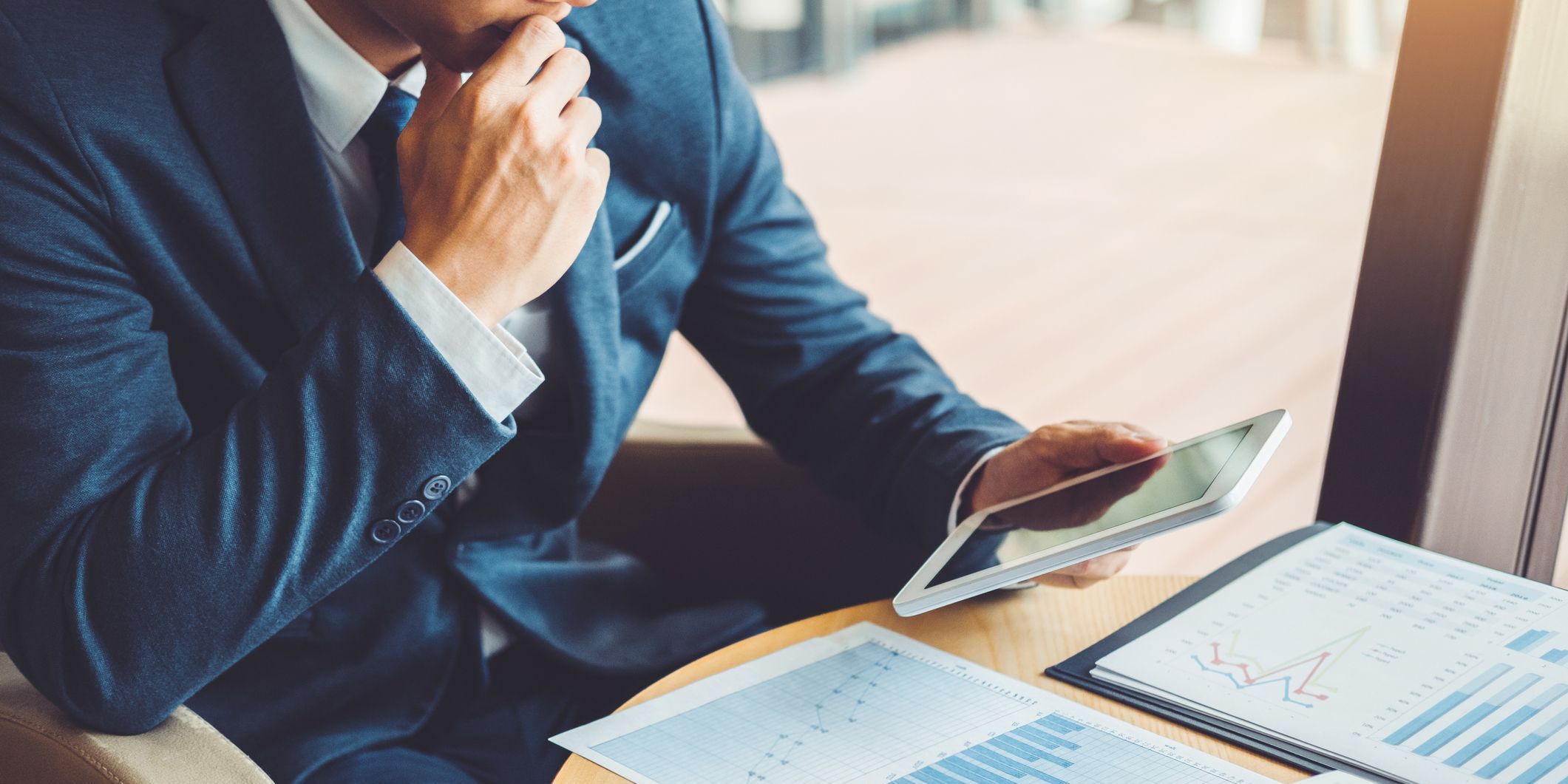 An investment banker working at his desk.