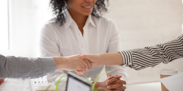 An arbitrator encouraging and facilitating communication between two disputants.