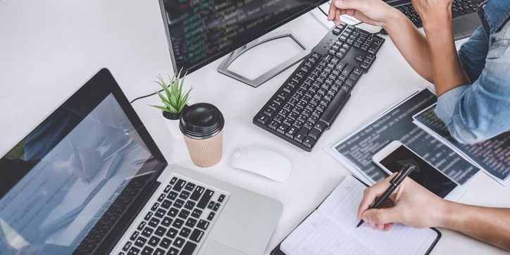 An online course developer working on the computer.