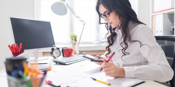 A bookkeeper recording financial transactions.