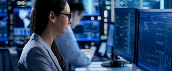 A security architect working on her computer.