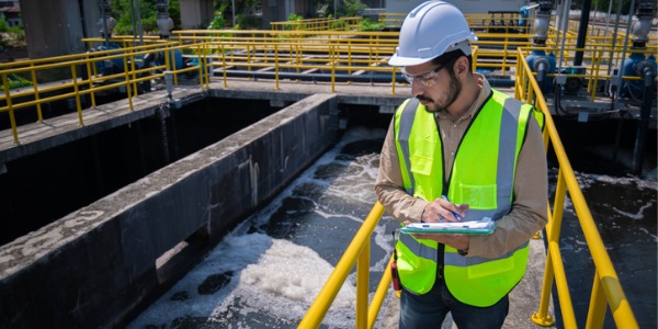 An environmental engineer conducting an assessment of a wastewater treatment system.