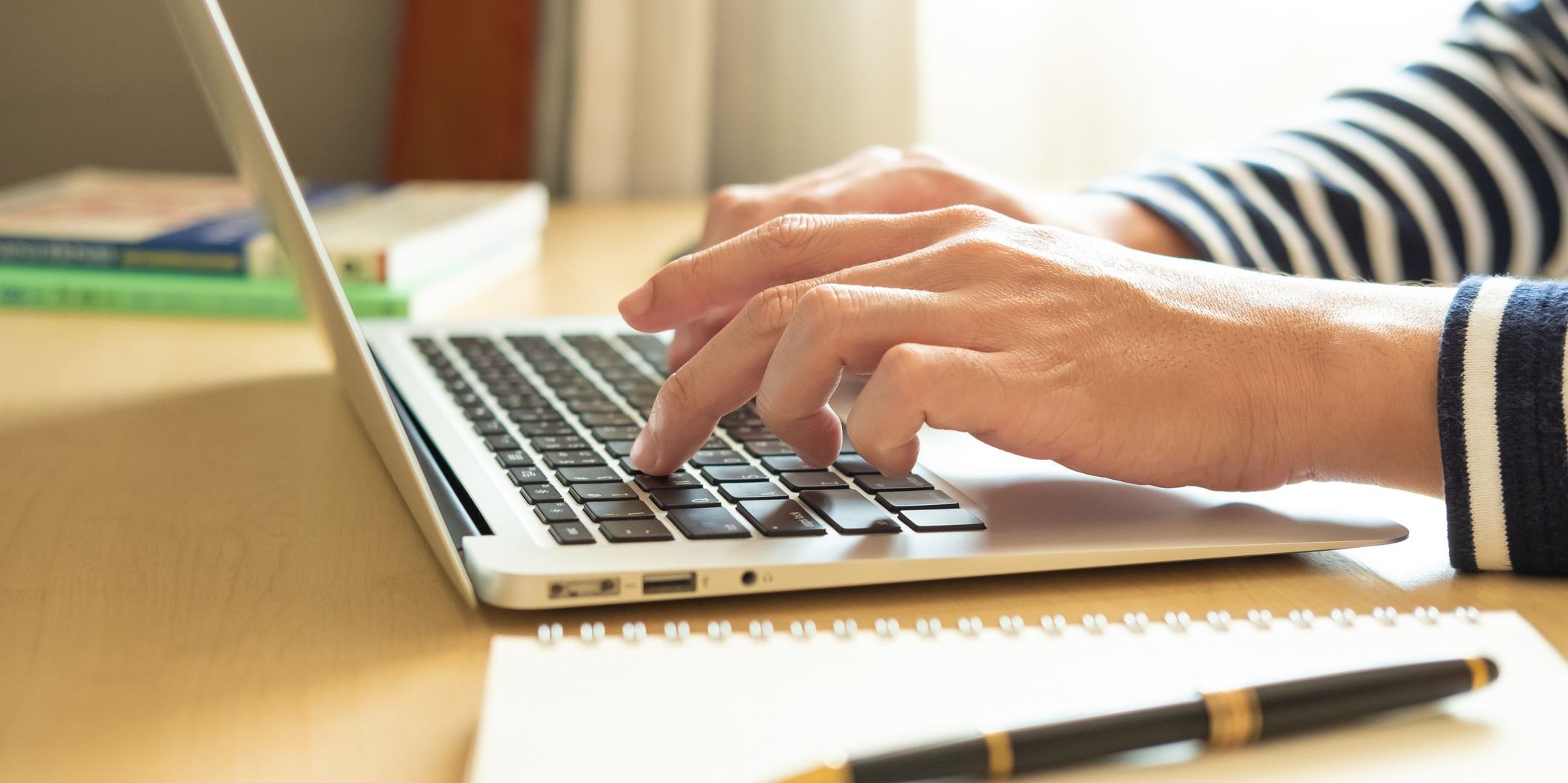A librettist working on her computer, creating a libretto.